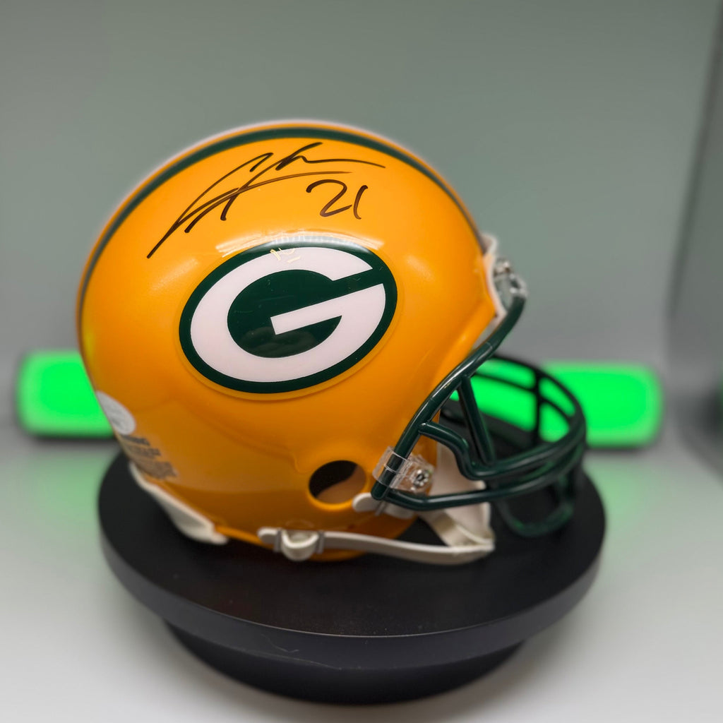 Autographed Packers mini helmet with black signature