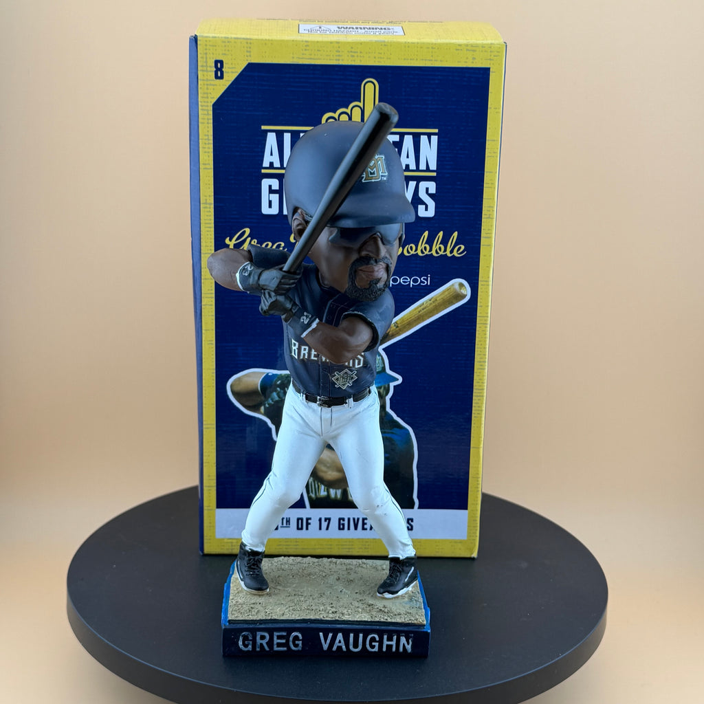 Bobblehead figure of a baseball player with packaging in the background