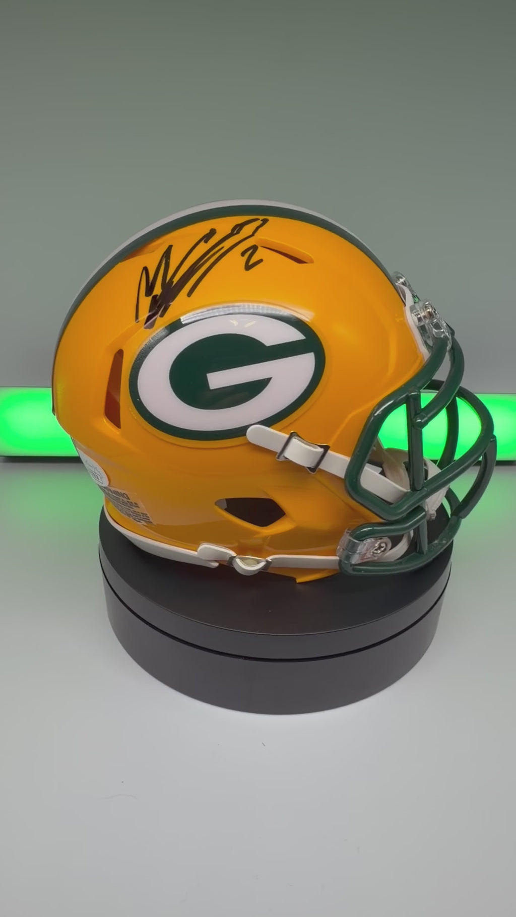 Video of autographed Packers mini helmet spinning on a turn table